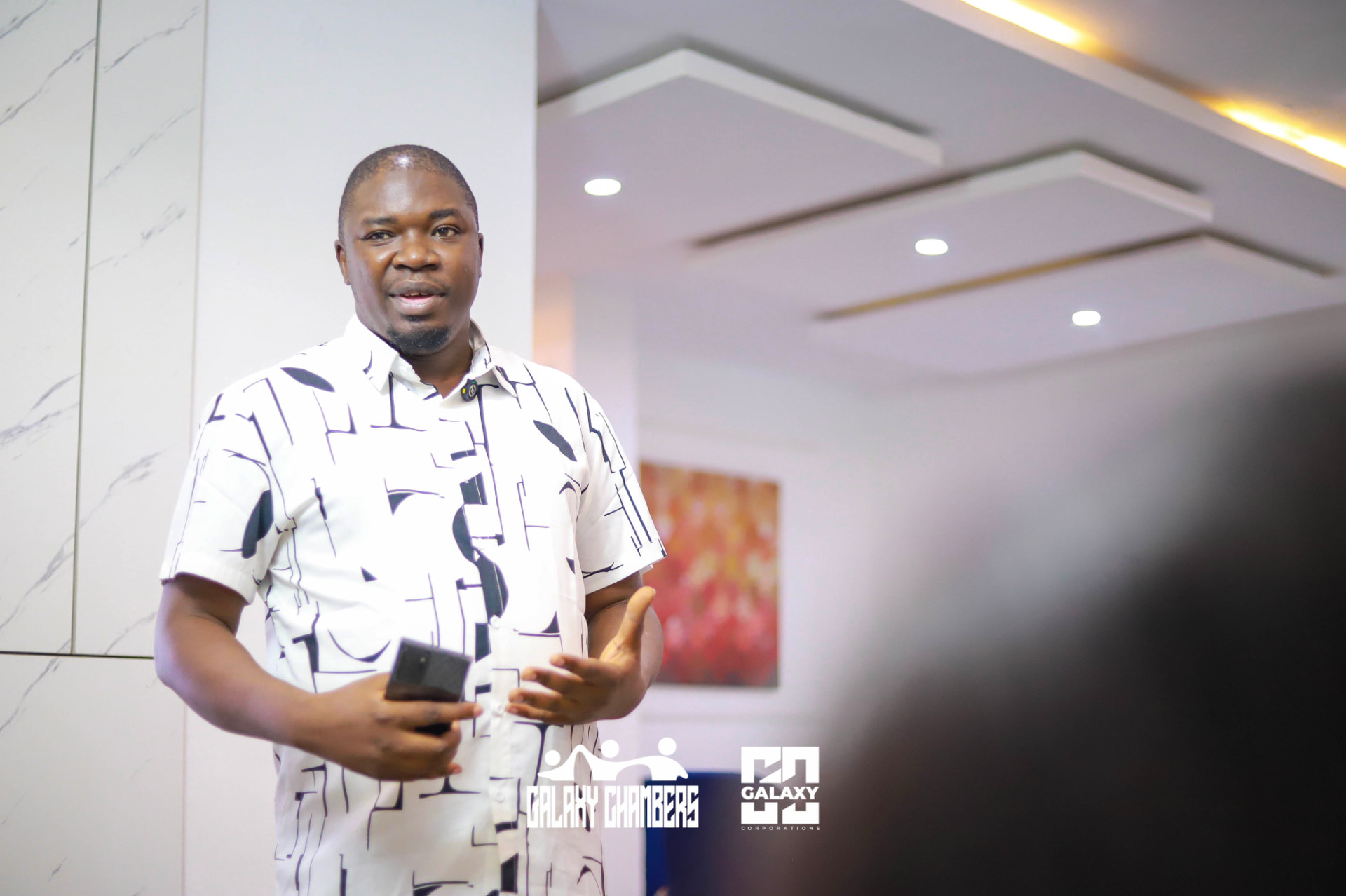 Speaker presenting at a Galaxy Chambers gathering