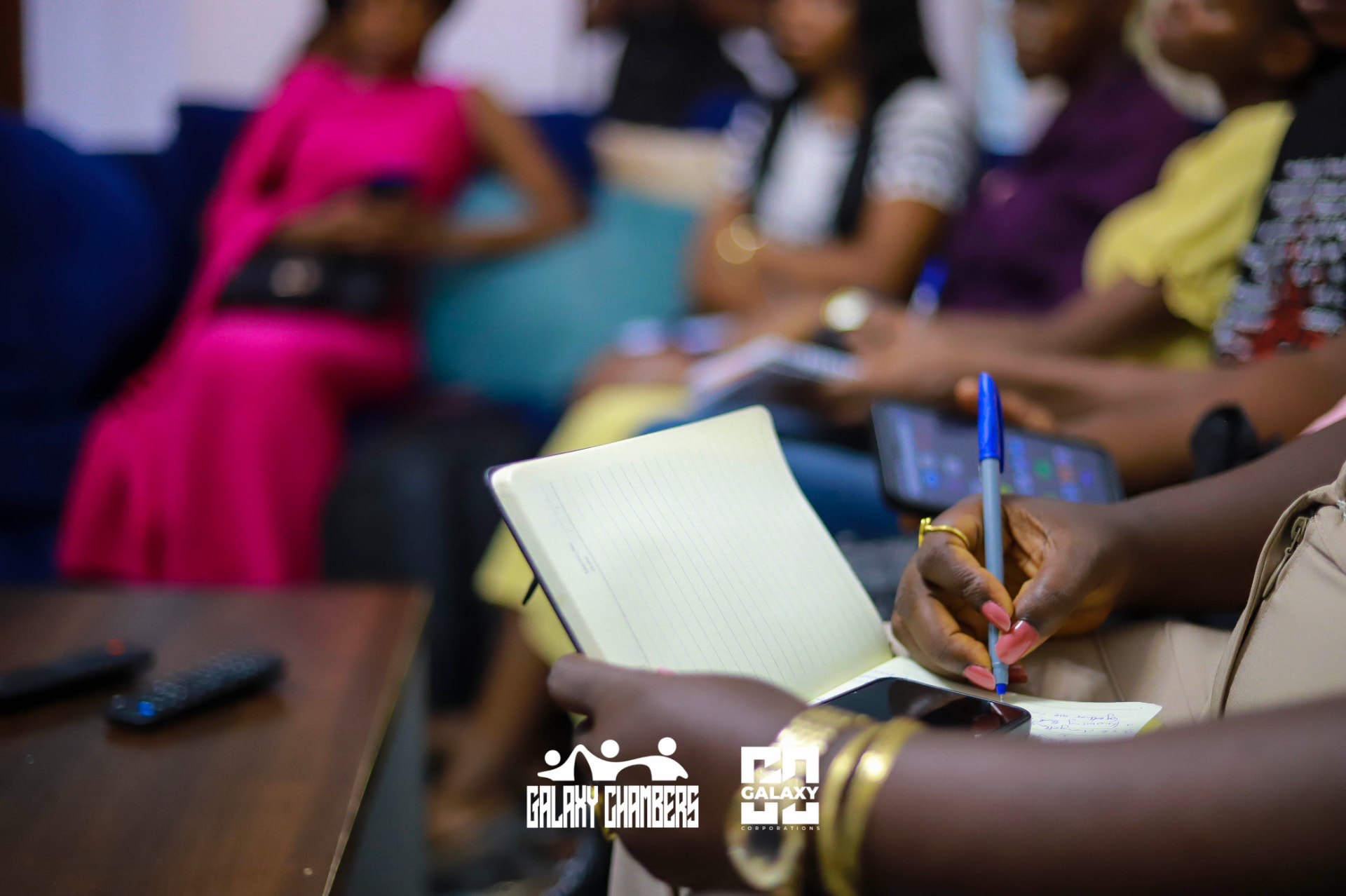 Member taking notes during a session